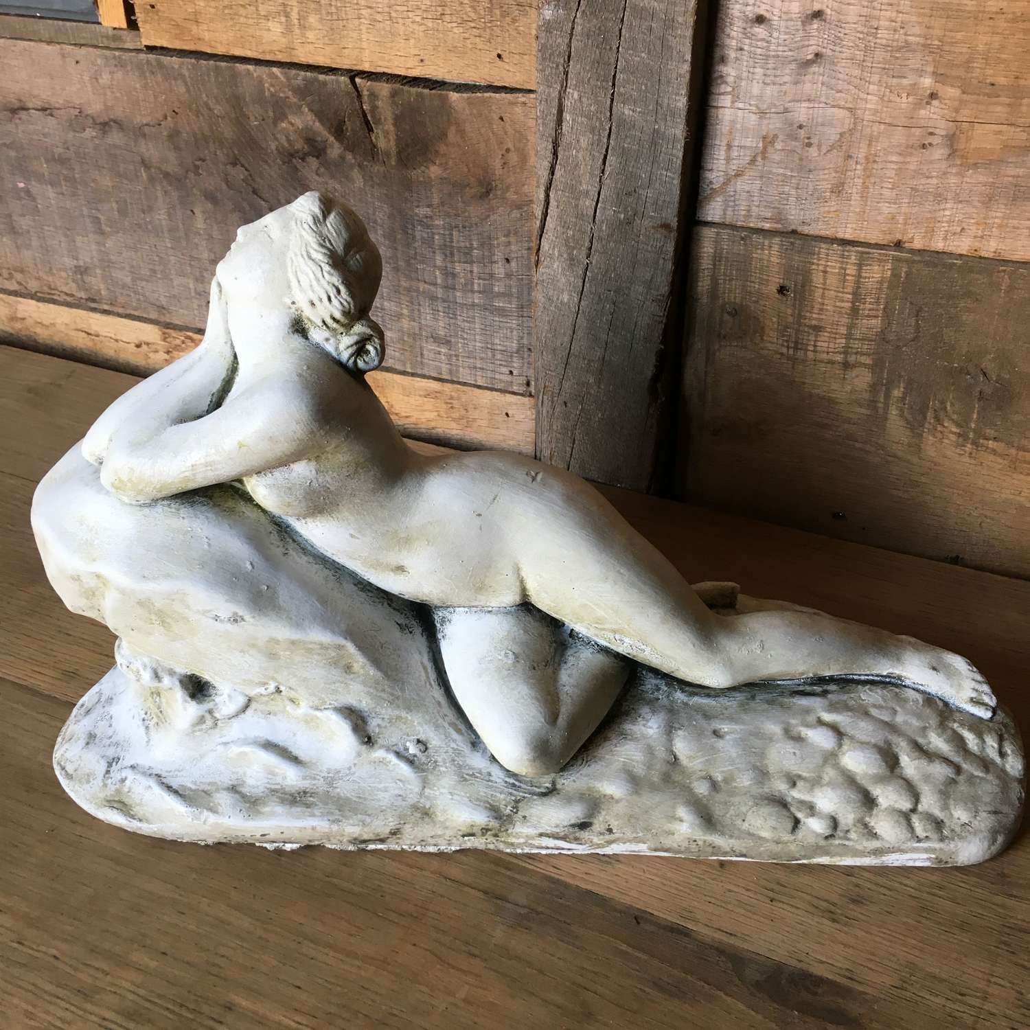 Stone statue of a naked woman