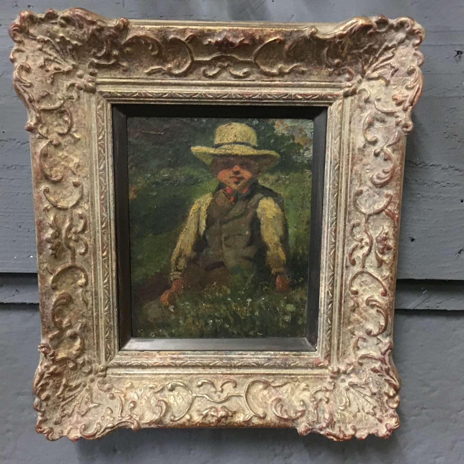 Oil on panel portrait of an Edwardian Boy wearing a sunhat