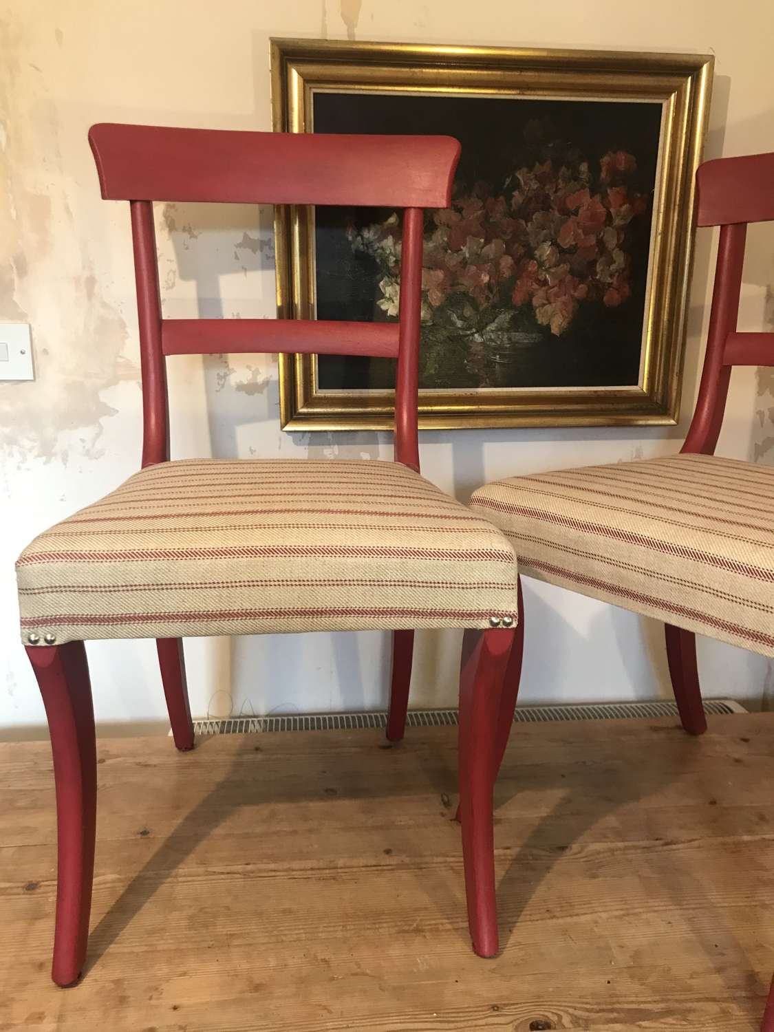 Eye catching pair of painted and upholstered dining chairs