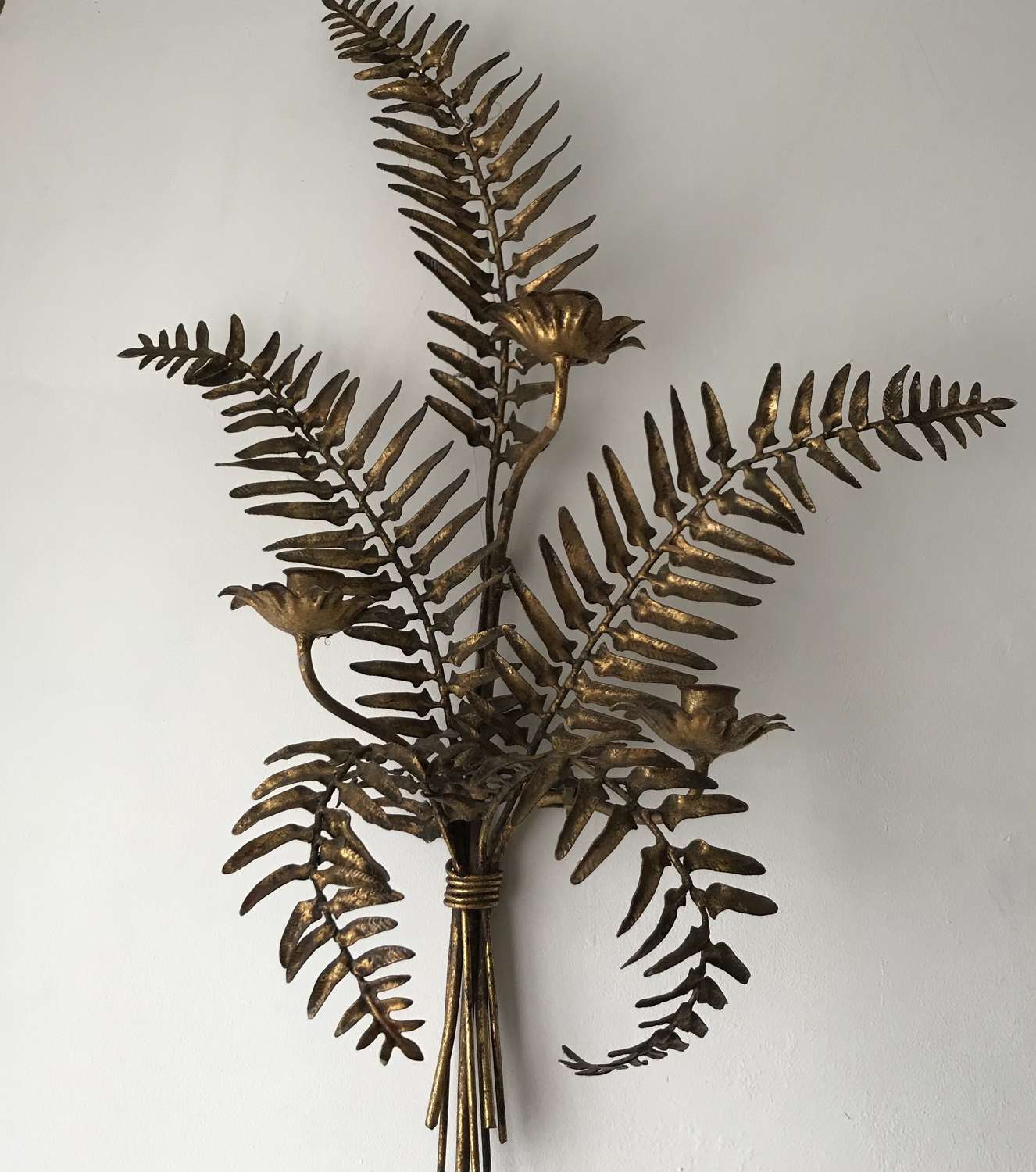 Pair of stylised ferns as gilded metal candle sconces