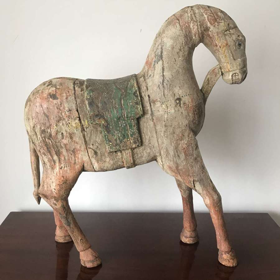 Antique carved wooden horse with old paint