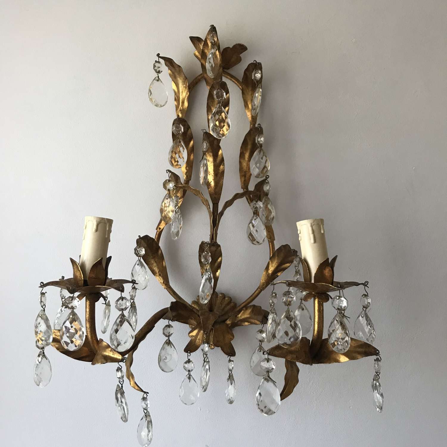 Vintage French gilt and crystal wall lamp.