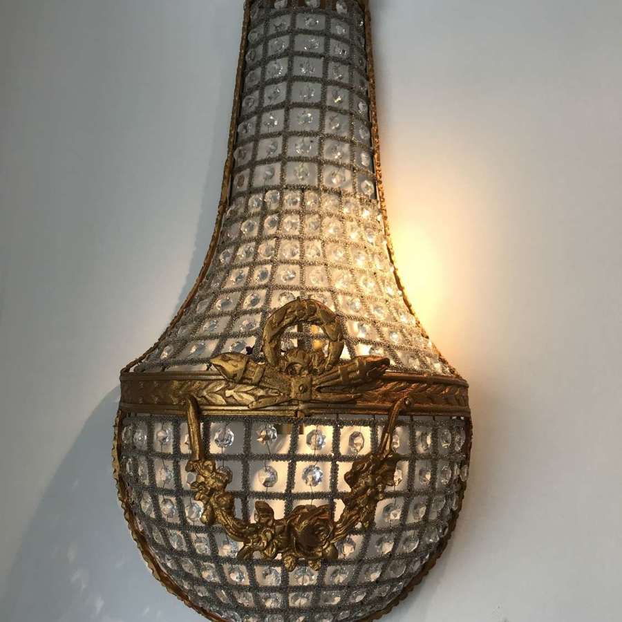 Trio of large French empire gilt and crystal wall lamps