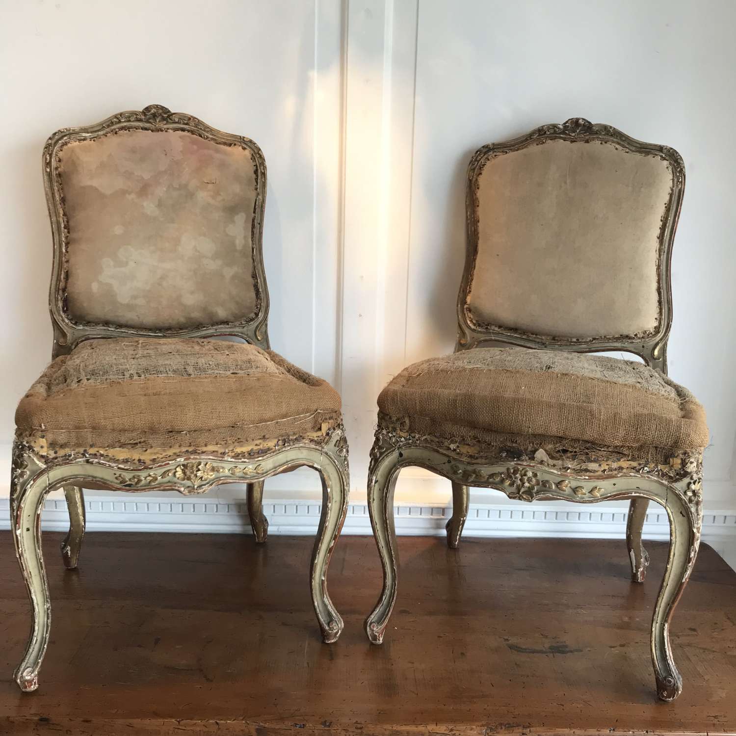 A pair of 18th century painted & gilded French chairs