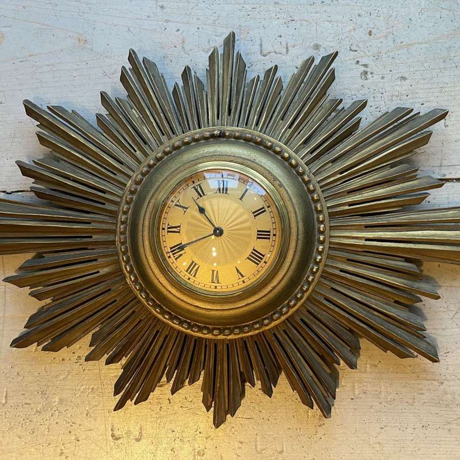 1930’s French sunburst wall clock.